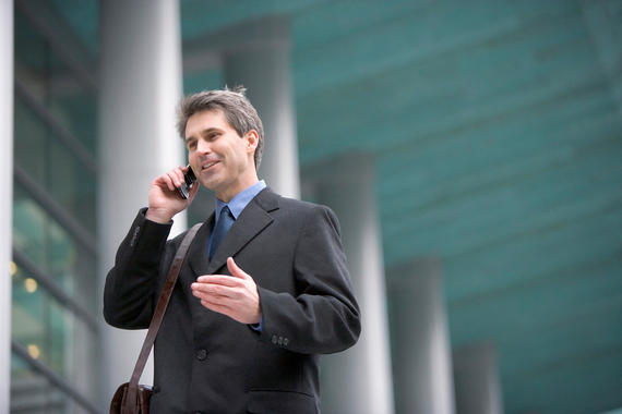 Future Perfect Tense - Businessman in Front of Office Building Using Cell Phone